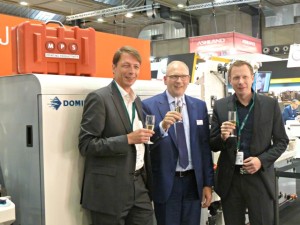 First SYMJET Press sold to customer Optikett: Matthias and Daniel Ostendorf and Bert van Brink of MPS
