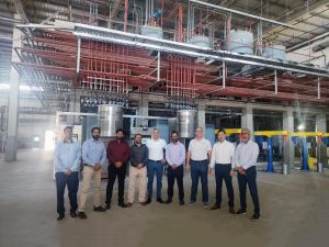 Roberto Anfrea DIC team infromt of DIC dispensers